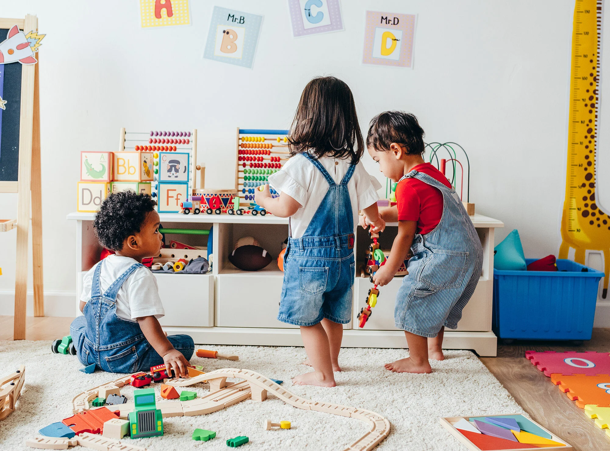 Two toddlers playing in the church kids playroom